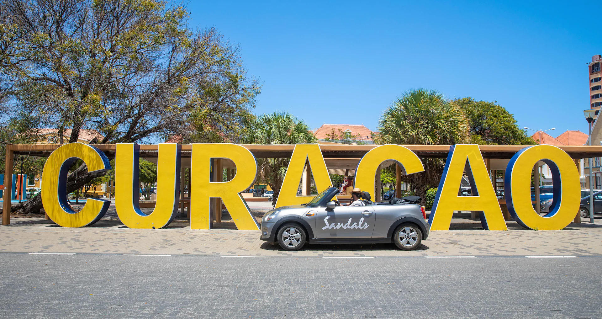 Curacao sign with Sandals car
